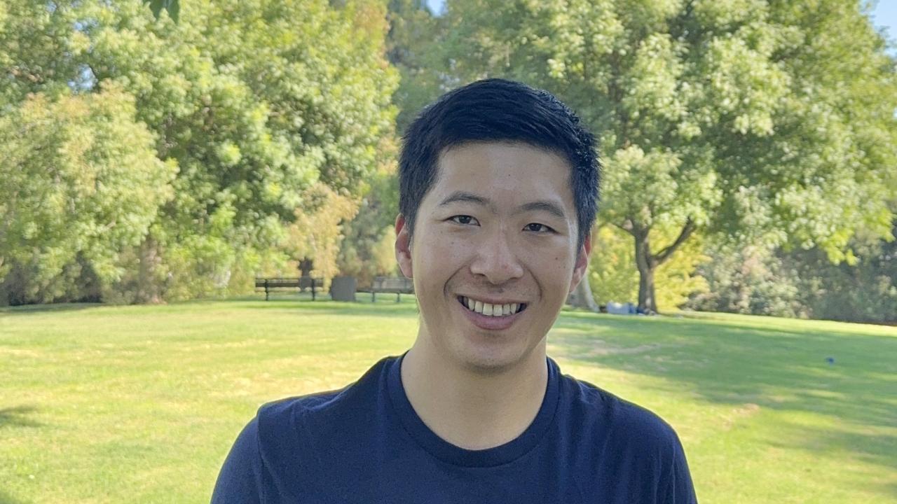 UC Davis School of Veterinary Medicine student Brian Wang wearing CVET shirt