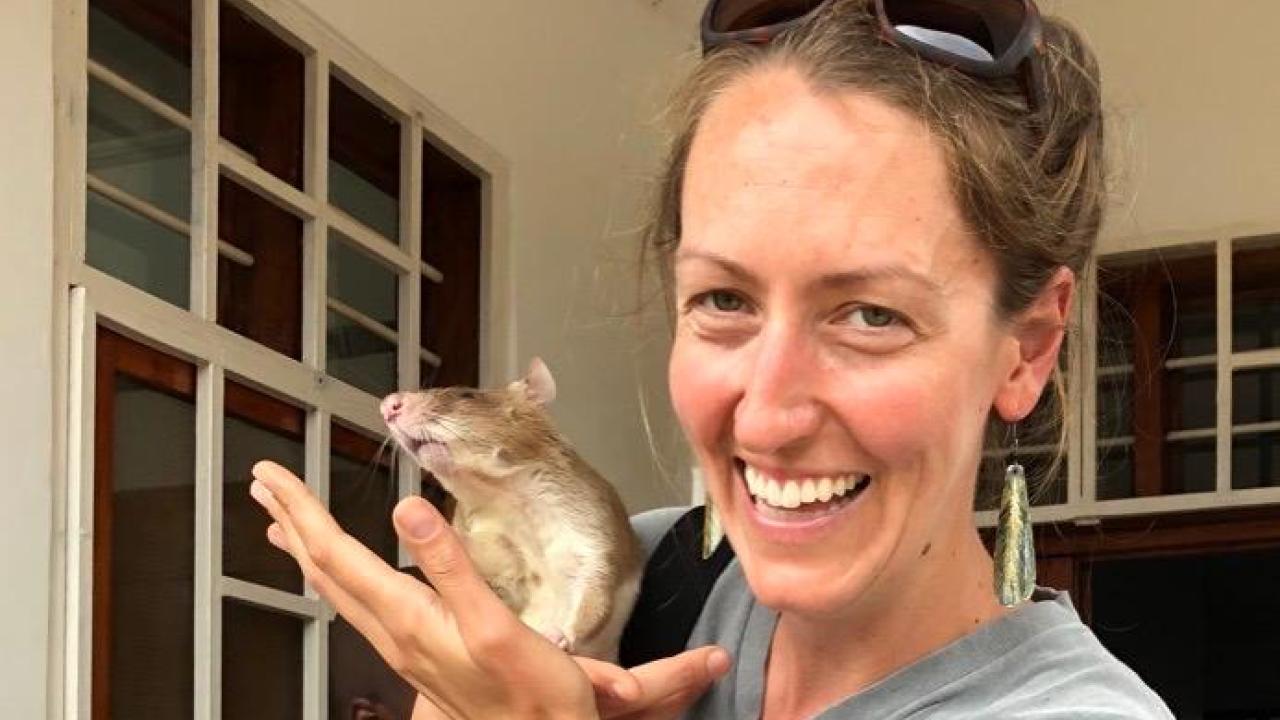 Jennie Lane holding an apopo rat