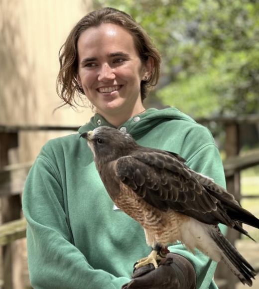 lexi durant holding swainson's hawk named grasshopper on the glove